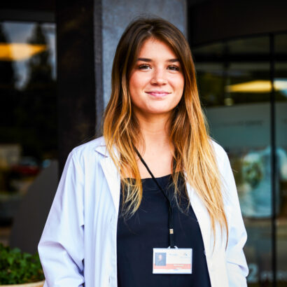 A student smiling at the camera.