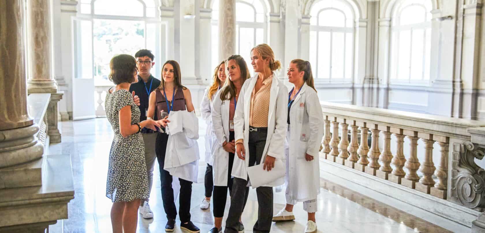 Students listening while getting a tour.
