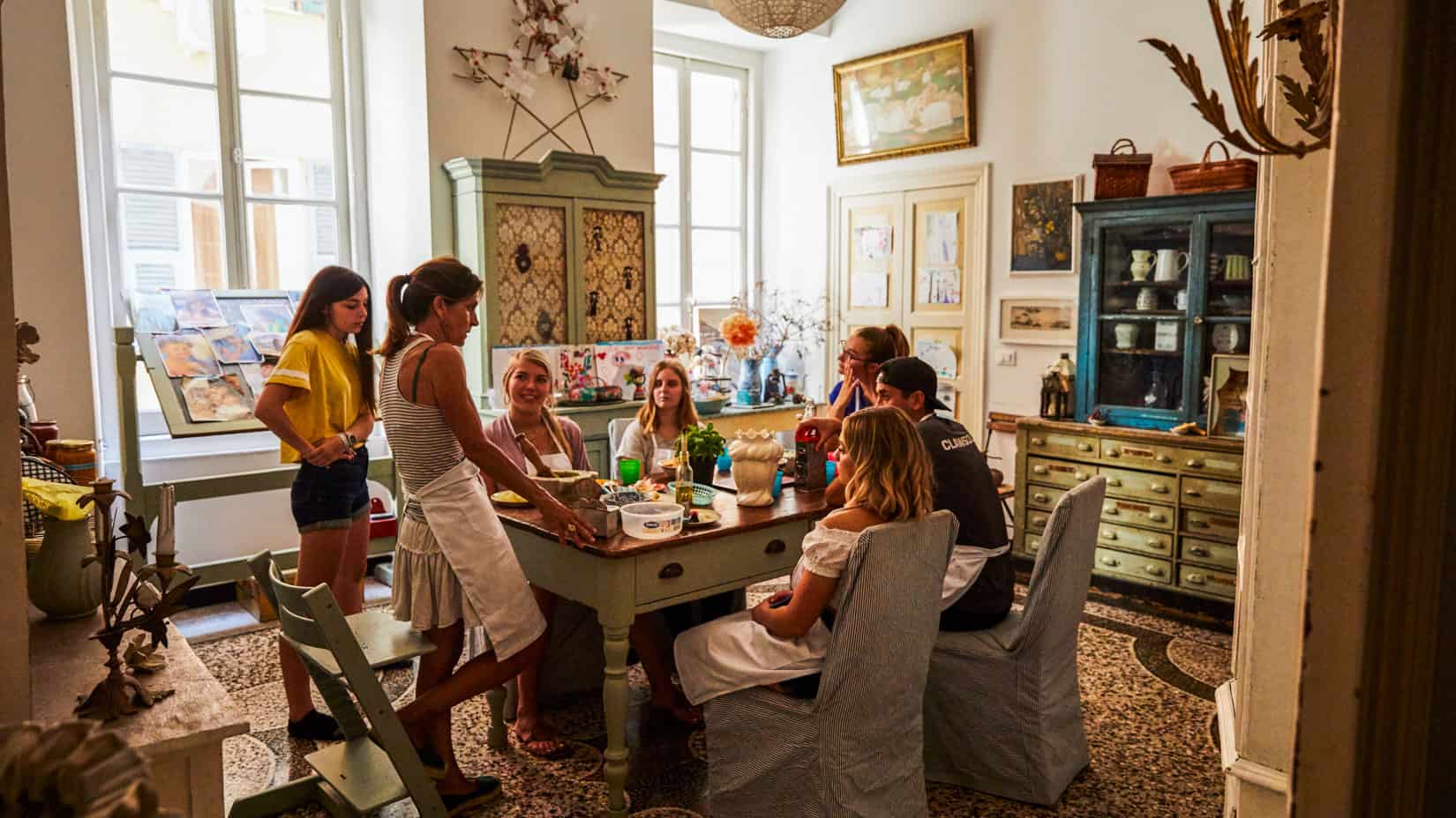 Students learning how to make pesto in Italy.