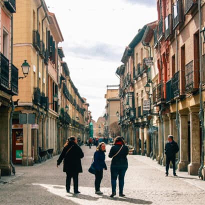 Students walking down a city street.