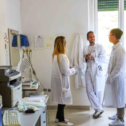 Students speaking in a hospital room.