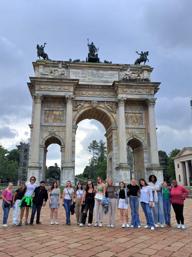 Atlantis students in front of a monument in Milan, Italy.